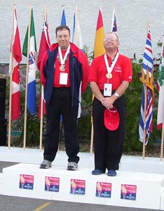 Two athletes accepting gold in the doubles competition