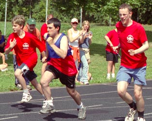 Three athletes sprinting