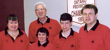 Four five-pin bowlers, with their coach