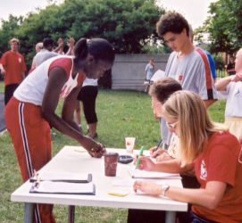 Volunteers keeping track of scores at a Track and Field Meet