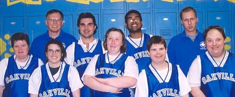 Seven basketball players, with two coaches