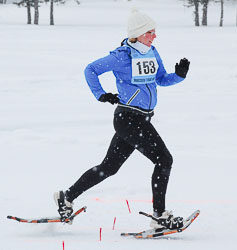 Athlete racing on snowshoes