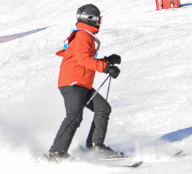 Athlete finishing downhill ski